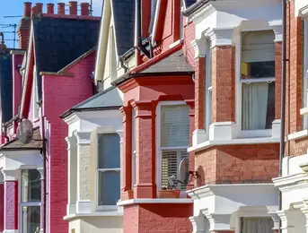 a row of houses with red and white brick